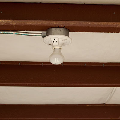 A light fixture hanging from the ceiling of a room.